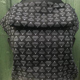 Integra shine bright design baby carrier available at a Babipur.  A black carrier with a geometric style diamond design. Features a small hood for head protection.