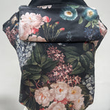 Integra vintage summer baby carrier available at a Babipur a dark coloured carrier with a vintage flower design. Features a small hood for head protection.