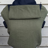 Integra khaki texture linen baby carrier available at a Babipur. Features a small hood for head protection.