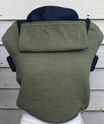 Integra khaki texture linen baby carrier available at a Babipur. Features a small hood for head protection.