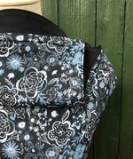 A close up of the Integra Copenhagen flower baby carrier available at a Babipur 