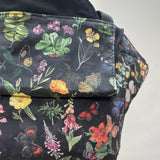 A close up of the flower garden design on the Integra flower garden baby carrier available at a Babipur