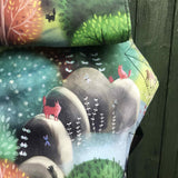 A close up of the sketch style forest design on the Integra forest glade baby carrier available at Babipur.