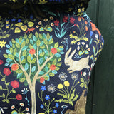 A close up of the playful rabbit and tree design on the Integra folic baby carrier available at Babipur.