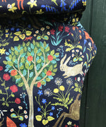 A close up of the playful rabbit and tree design on the Integra folic baby carrier available at Babipur.