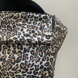 A close up of the leopard print and hood detail on the Integra baby carrier available at Babipur.