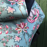 A close up of the Integra Martha baby carrier available at a Babipur showing the vintage pink floral design in detail