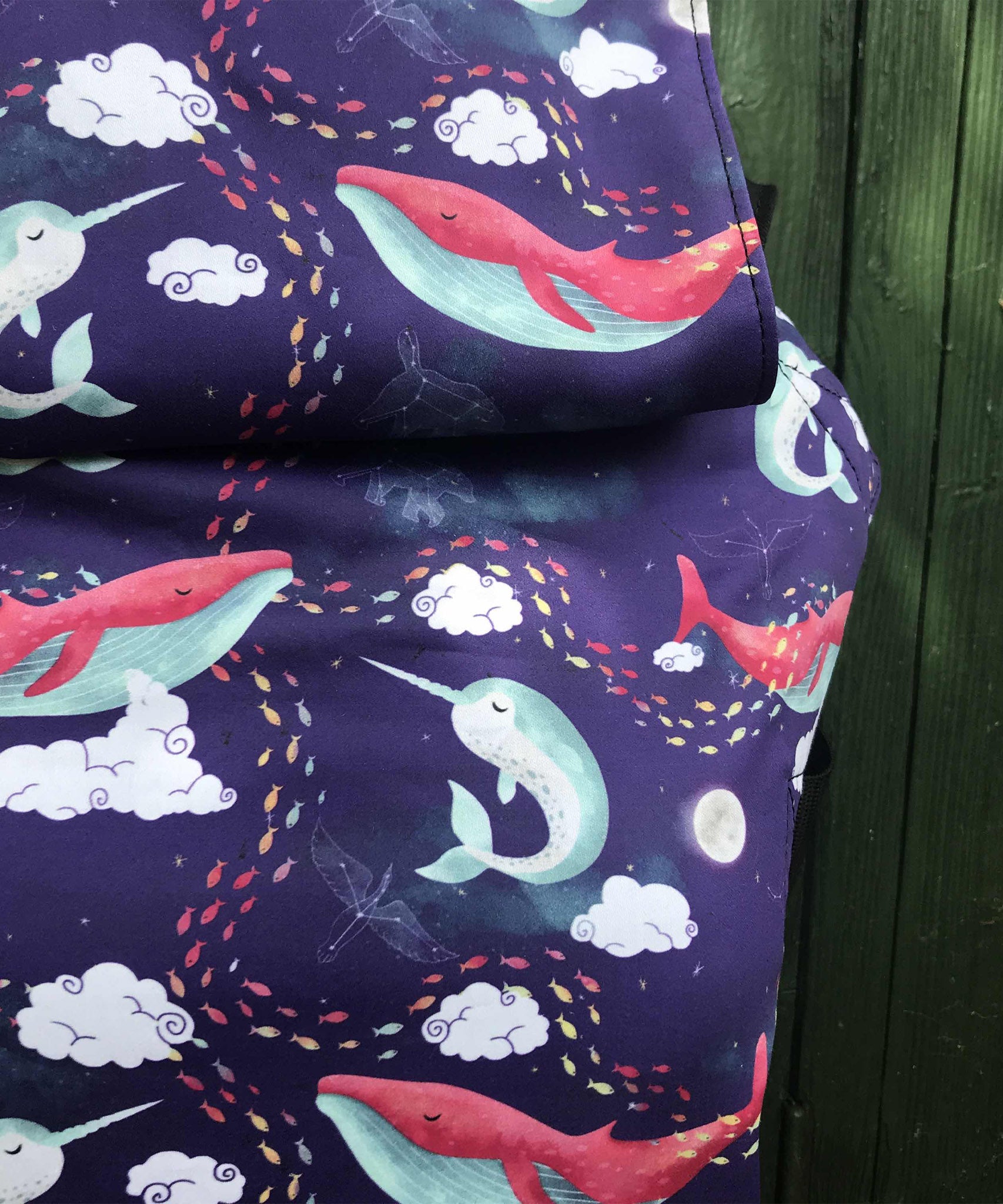 A close up of the sleeping whales design on the Integra ocean slumber baby carrier available at Babipur. 