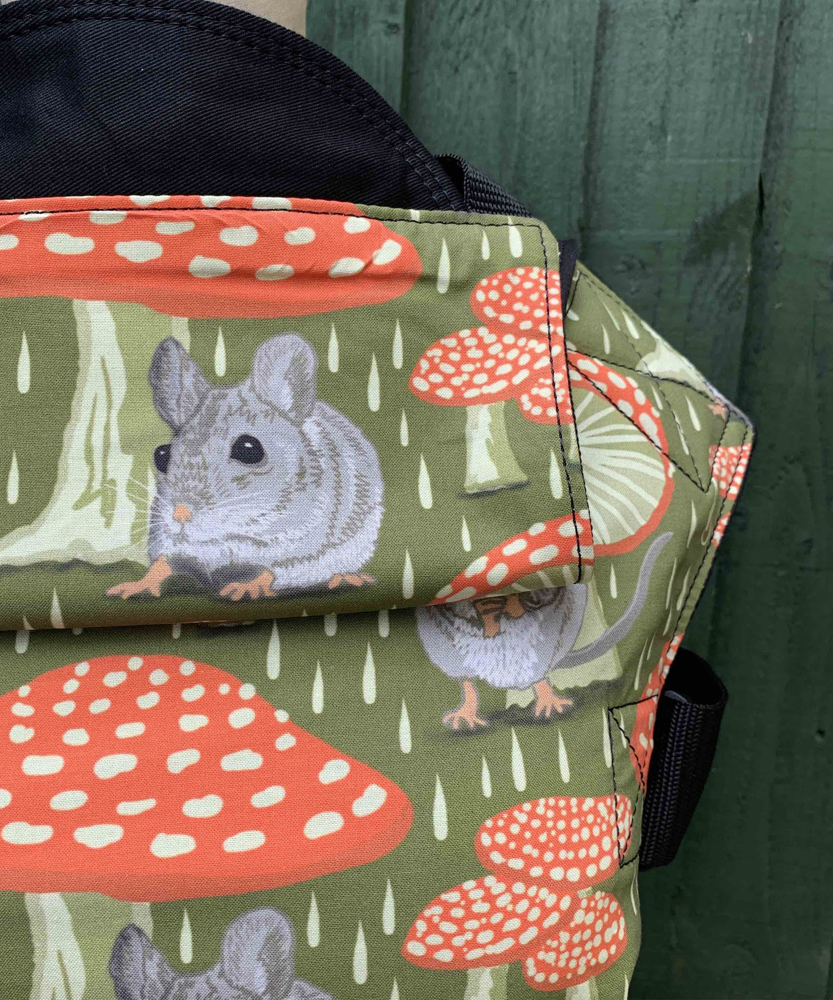 A close up of the vintage mouse design and hood detail on the Integra shelter baby carrier available at Babipur.