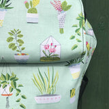A close up of the house plants design on the Integra viva baby carrier available at a Babipur 