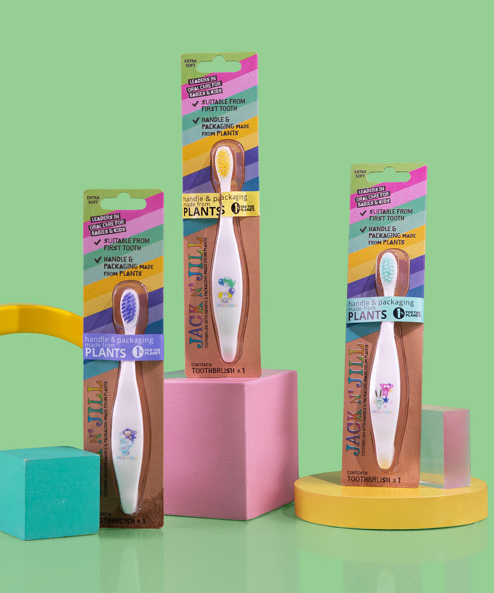 Three Jack N' Jill soft bristled children's toothbrushes shown in their  colourful packing. There are three different designs. 