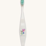 A Jack N' Jill soft bristled children's toothbrush. This toothbrush has mint green bristles and features koala and bunny rabbit characters on it.
