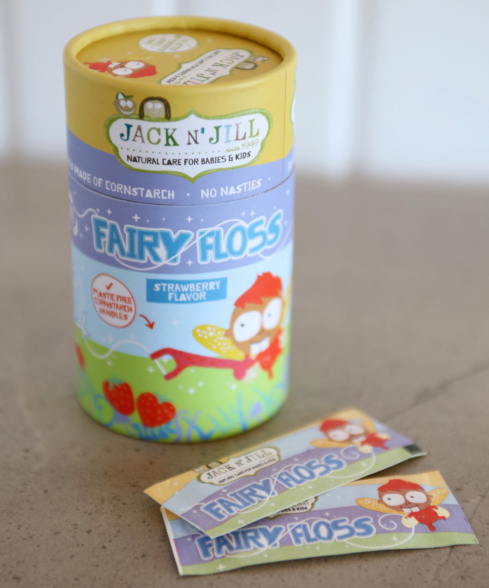 A tub of Jack N' Jill Fairy Floss - Strawberry with individually wrapped picks inside. 