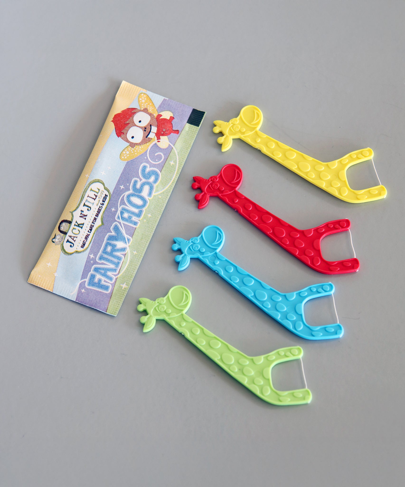 The giraffe shaped floss picks from the Jack N' Jill Fairy Floss - Strawberry 