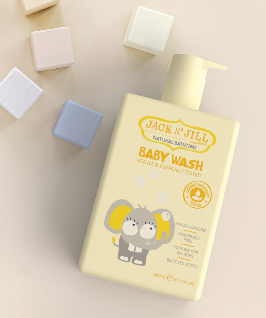 Jack N' Jill Baby Wash on a cream surface surrounded by pastel coloured blocks. 