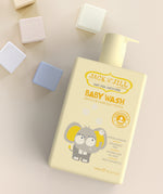 Jack N' Jill Baby Wash on a cream surface surrounded by pastel coloured blocks. 