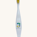 A Jack N' Jill soft bristled children's toothbrush. This toothbrush has yellow bristles and features crocodile and elephant characters on it.