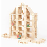 Just blocks eco-friendly wooden stacking shape toys stacked into a dolls house shape on a white background
