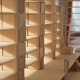 Close up of the Just Blocks handmade wooden shapes stacked in a row of neat towers