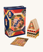 The Kapla 200 Autumn coloured building planks box, next to a small sculpture and an inspiration leaflet.