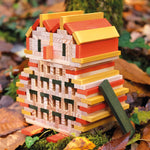 An owl sculpture, built from the Kapla 200 Autumn coloured wooden plank building block toys.
