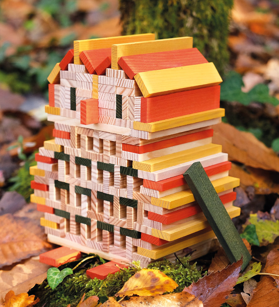 An owl sculpture, built from the Kapla 200 Autumn coloured wooden plank building block toys.