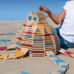 A large circular shaped stack created using the Kapla 200 set in Summer colours. 
