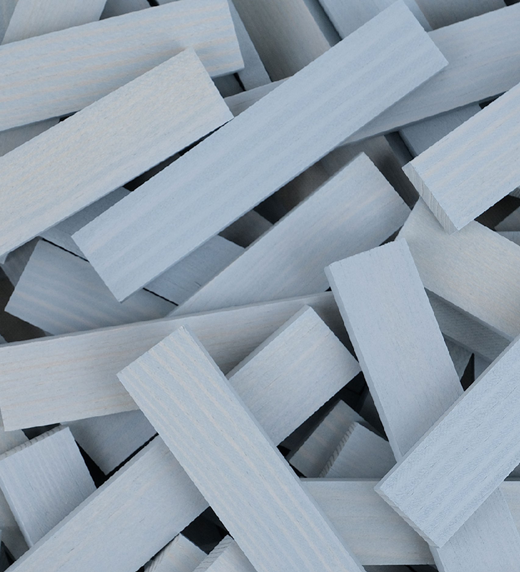 A pile of grey coloured Kapla planks.