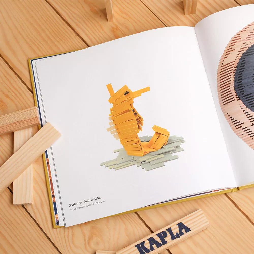 The Kapla Best Of artist collector's book, opened to show a page with a picture of a wooden Kapla seahorse sculpture.
