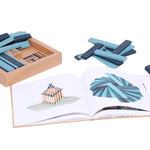 Kapla eco-friendly wooden block and book set spread out on a white background