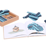 Kapla eco-friendly wooden block and book set spread out on a white background