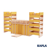 Kapla plastic-free wooden stacking blocks built up in a fort shape on a white background