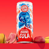 Karma Drinks Organic Fairtrade Cola can displayed with real kola nuts, highlighting its natural ingredients and ethical sourcing.