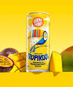 Karma organic tropikool mango & passion fruit soda in yellow coloured illustrated can surrounded by cut passion fruit and mango.