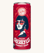 Close up of the Karma Drinks Cherry Lee organic cherryade can, featuring the bold red design and Fairtrade soft drink branding.