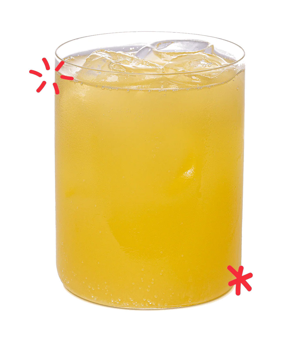 Organic orangeade served over ice, showing the bright citrus colour and refreshing fizz of Karma Drinks’ Fairtrade orange soda.