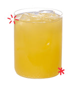 Organic orangeade served over ice, showing the bright citrus colour and refreshing fizz of Karma Drinks’ Fairtrade orange soda.