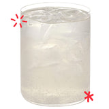 Karma Drinks Tropikool organic mango & passionfruit soda, in a glass with ice. 