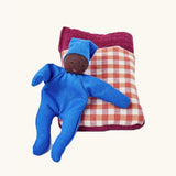 Kathe Kruse tiny organic cotton Waldorf baby doll with a gingham sleeping bag.