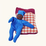Kathe Kruse tiny organic cotton Waldorf baby doll with a gingham sleeping bag.