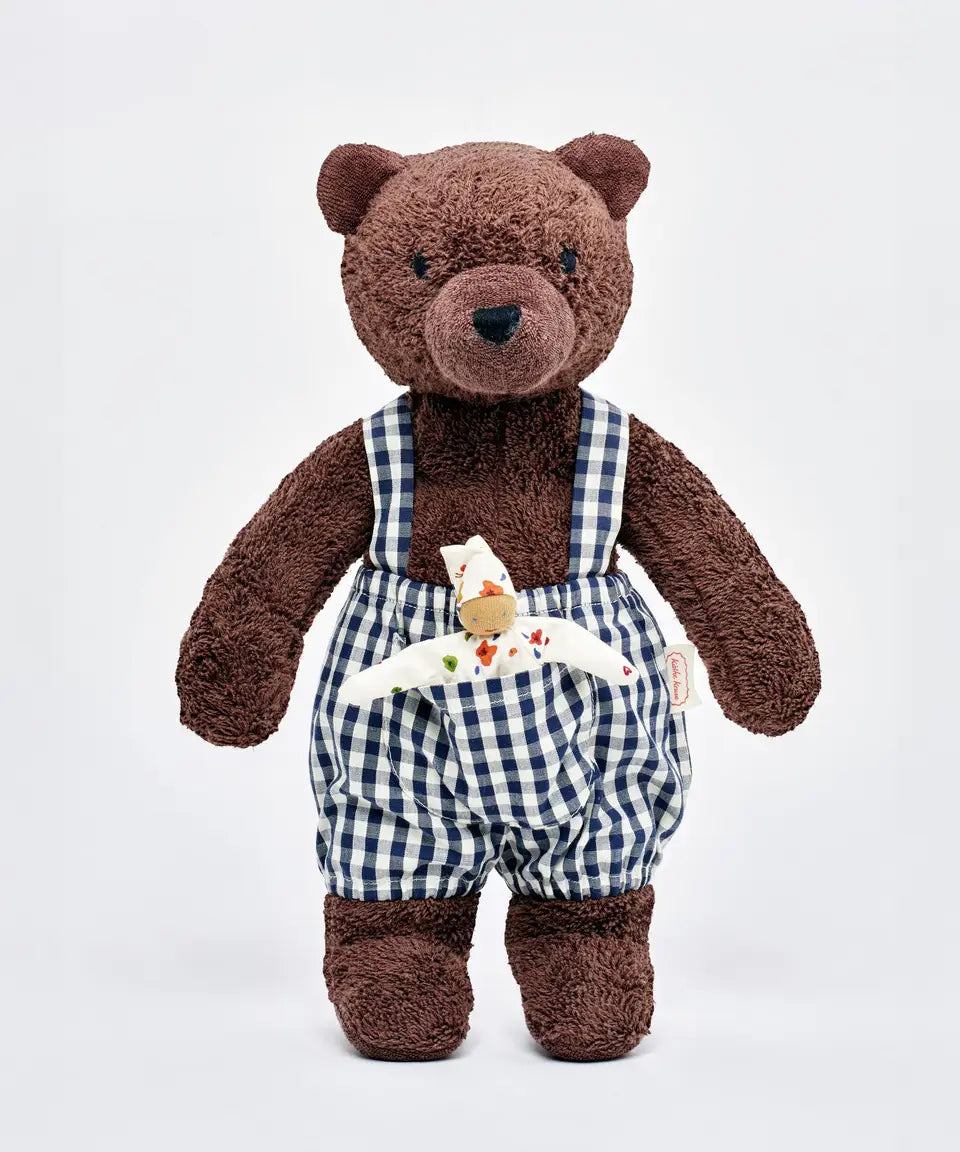Käthe Kruse Bella brown bear soft toy wearing blue and white gingham dungarees with white waldorf doll in pocket