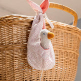 Käthe Kruse white duckling nest Animal music box soft toy. Small duckling soft toy in a white red spotted material nest.