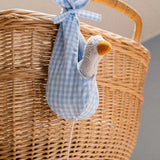 Käthe Kruse white duckling nest animal music box. Small white duckling soft toy in a blue and white check material nest.