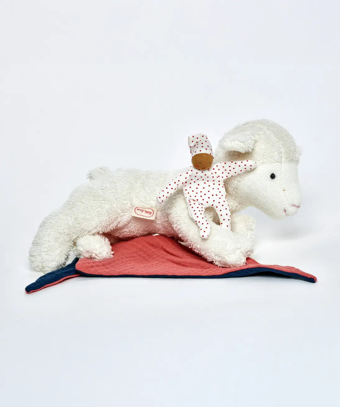 Kathe Kruse lying white lamb comforter with small white waldorf doll and muslin bib