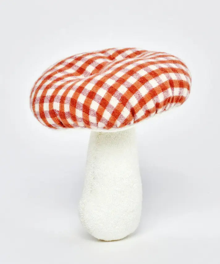 A standing Kathe Kruse mushroom soft grabber toy. Showing a red gingham top and white stem