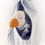 A white duckling soft toy sitting inside a blue gingham fabric nest from the Kathe Kruse animal music box set