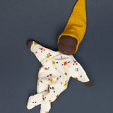 Käthe Kruse handmade Waldorf Doll Nini Sunshine with the legs crossed.