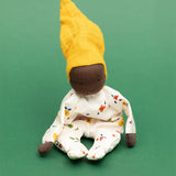Käthe Kruse Waldorf Doll Nini Sunshine placed in a sitting position. 