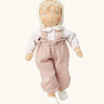 Käthe Kruse Waldorf doll Hannah with blond hair and white skin. Light pink dungarees, white red spotted shirt, cream bonnet and white shoes. 