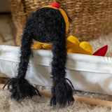 Käthe Kruse Waldorf Doll Kiki black hair, view of back with two long plaits. 